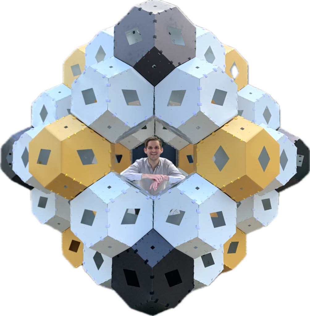 Peter Kagey in a Rhombic Dodecahedron made from Truncated Octahedra